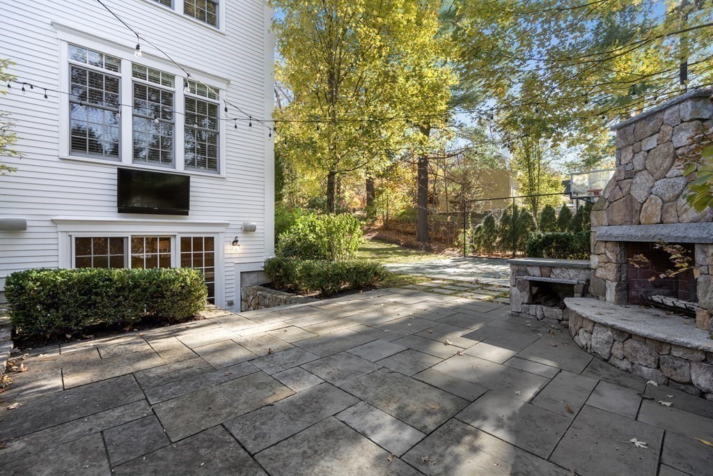 39 Temple Road Wellesley, MA 02482 - Photo 29 of 35 a view of a patio with table and chairs and potted plants