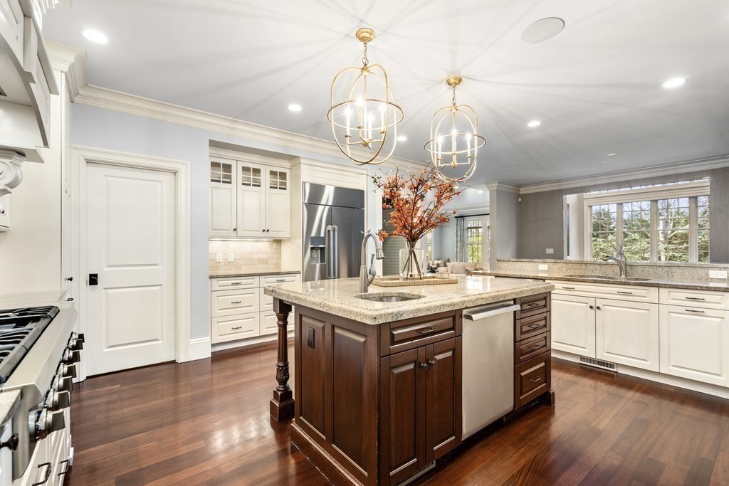 39 Temple Road Wellesley, MA 02482 - Photo 6 of 35 a kitchen with granite countertop a stove oven and a wooden floor