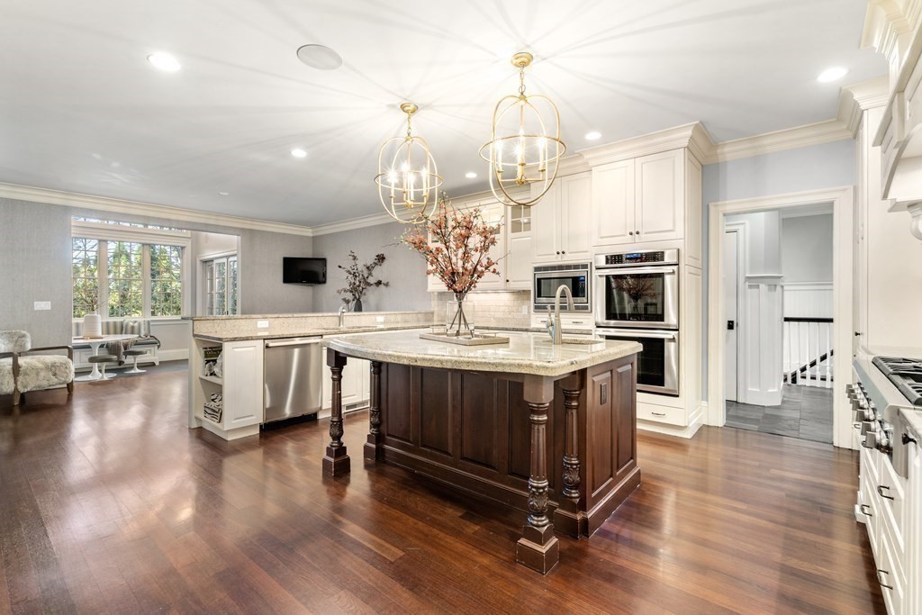 39 Temple Road Wellesley, MA 02482 - Photo 7 of 35 a kitchen with stainless steel appliances granite countertop a lot of counter space