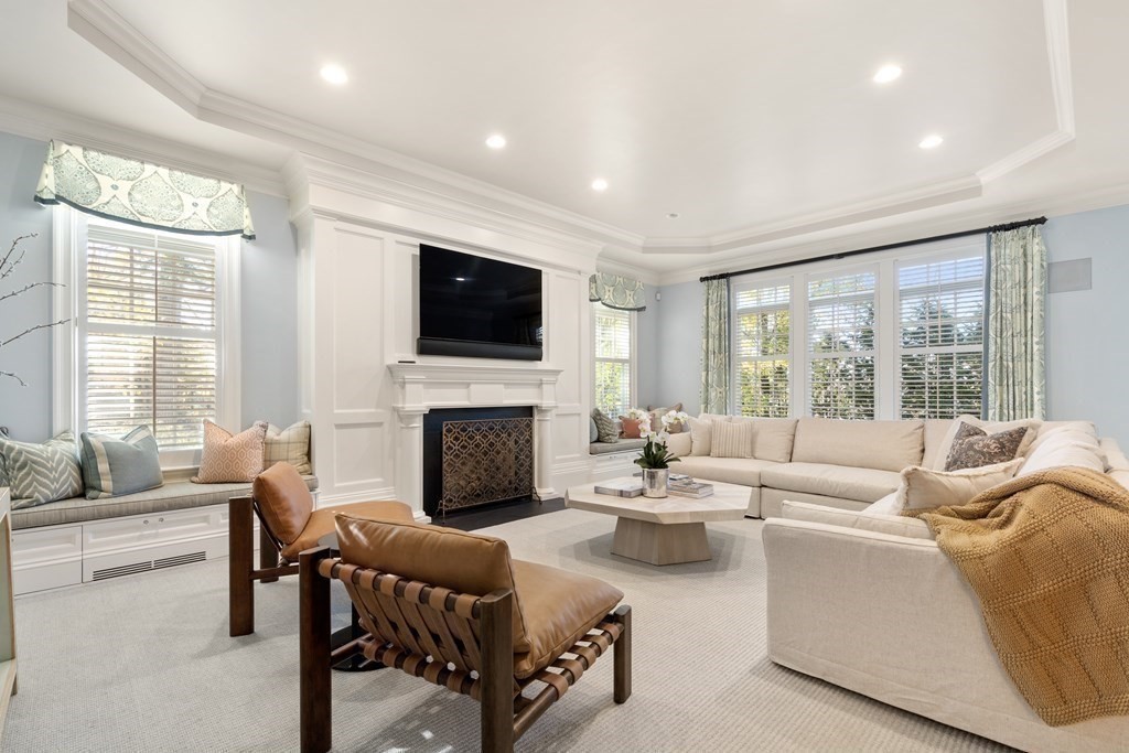 39 Temple Road Wellesley, MA 02482 - Photo 9 of 35 a living room with furniture a fireplace and a flat screen tv