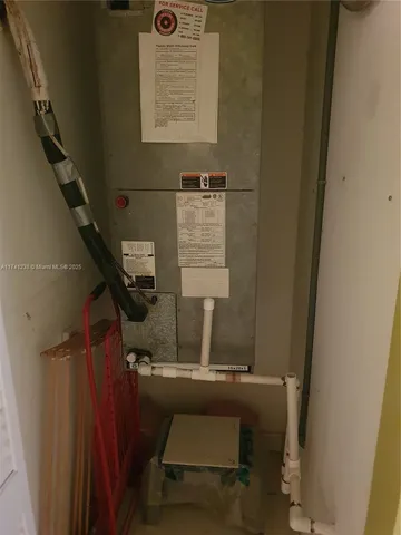 a bed room with a bed and a television