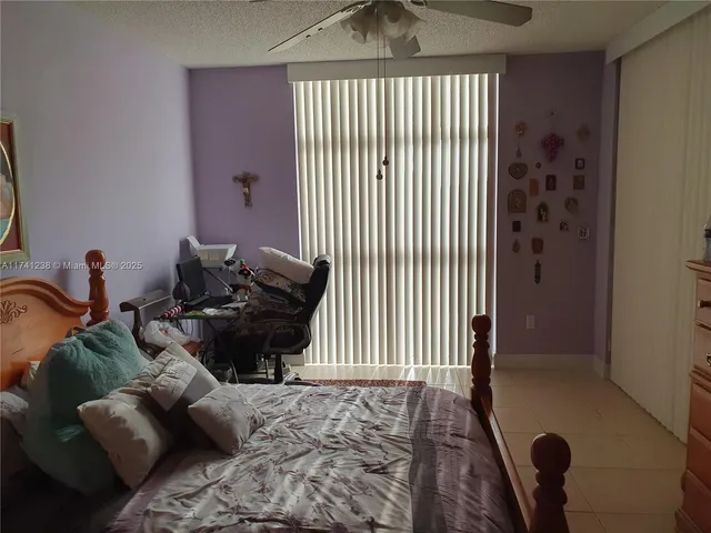 a kitchen with a cabinets and white stove top oven