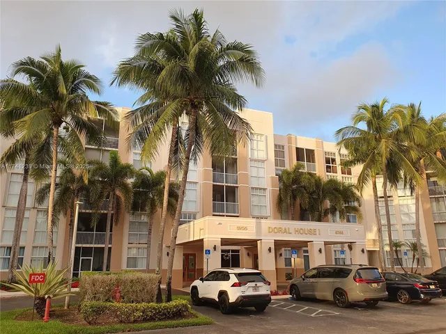 a kitchen with a sink cabinets and appliances