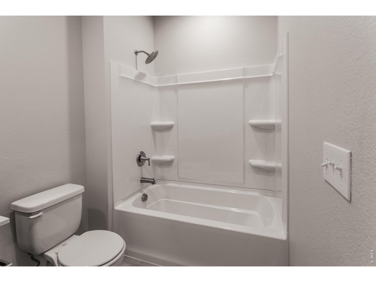 792 Chatter Road Windsor, CO 80550 - Photo 8 of 49 a bathroom with a toilet and a bathtub