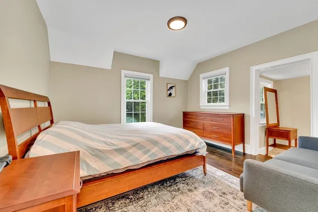 a bedroom with bed and window