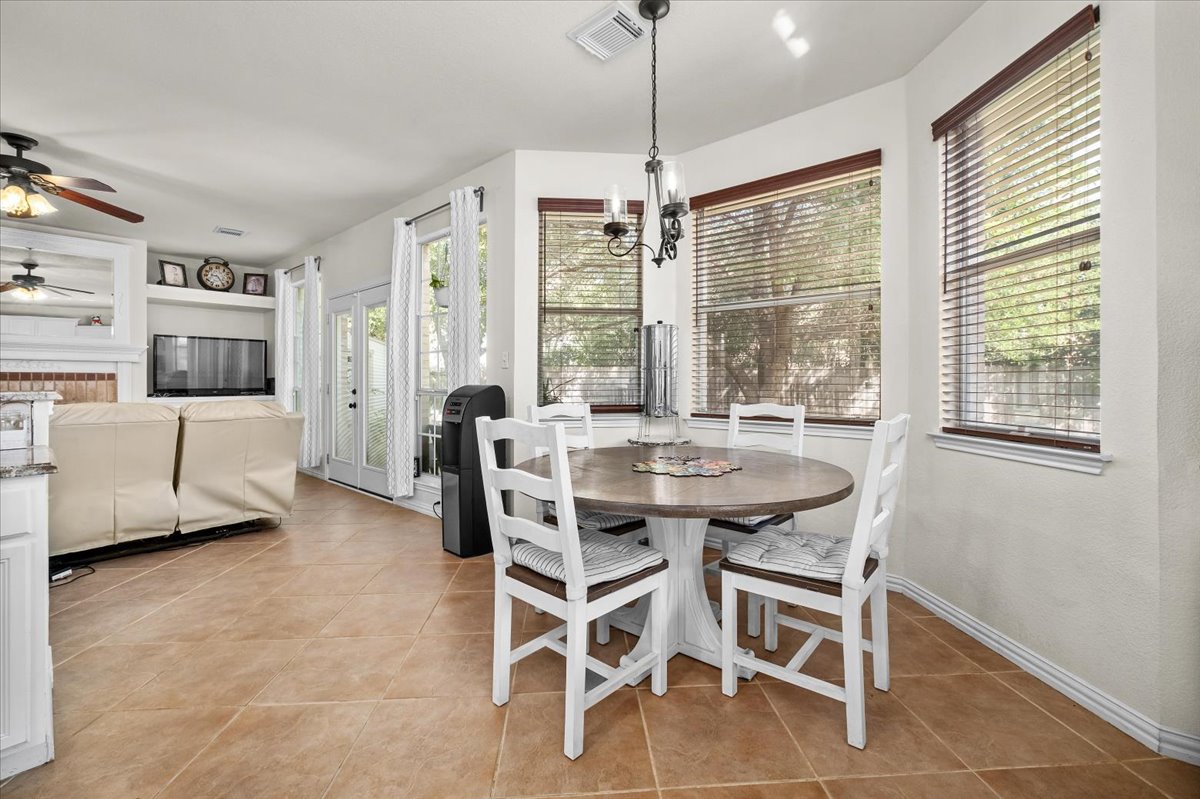 455 Logan Road Georgetown, TX 78628 - Photo 14 of 35 a view of a dining room with furniture window and outside view
