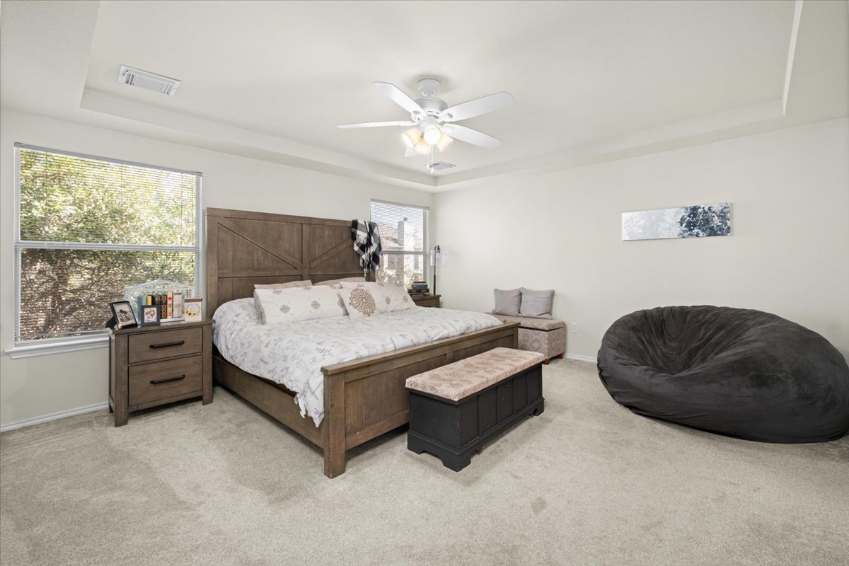 455 Logan Road Georgetown, TX 78628 - Photo 15 of 35 a bed room with a bed and a chair