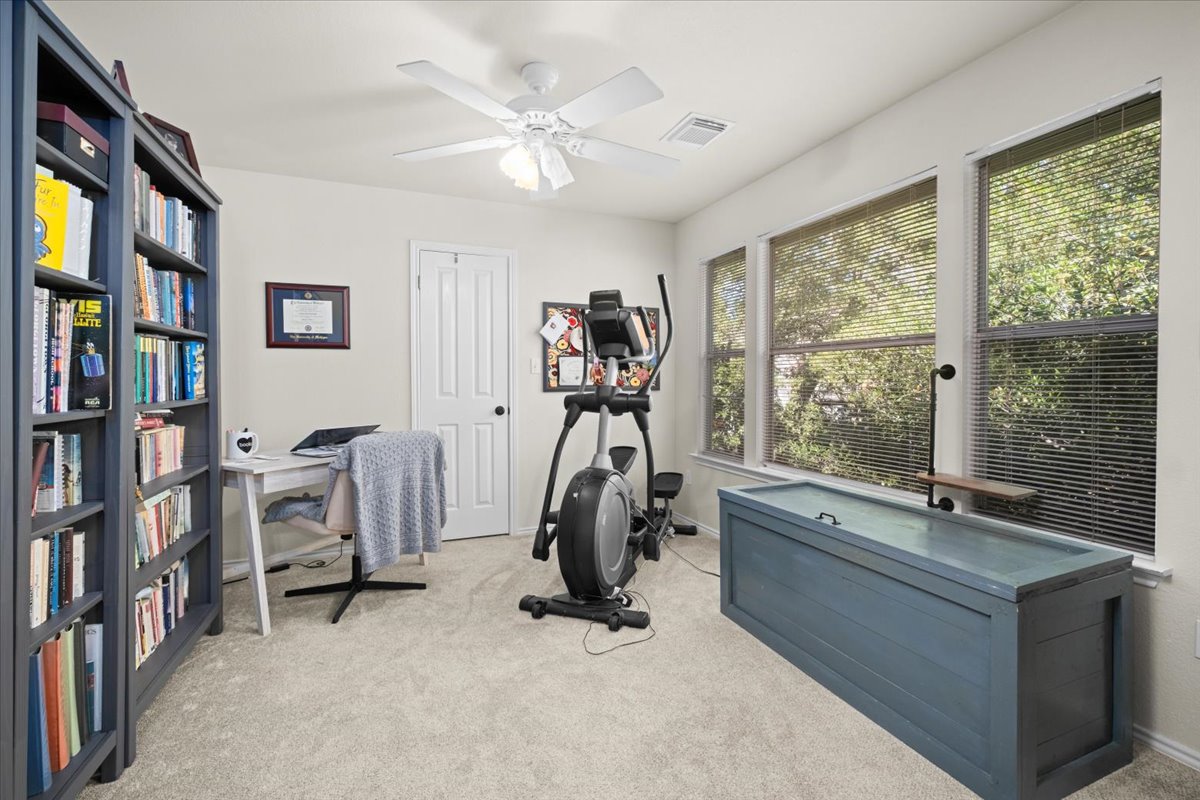 455 Logan Road Georgetown, TX 78628 - Photo 17 of 35 a view of a room with gym equipment