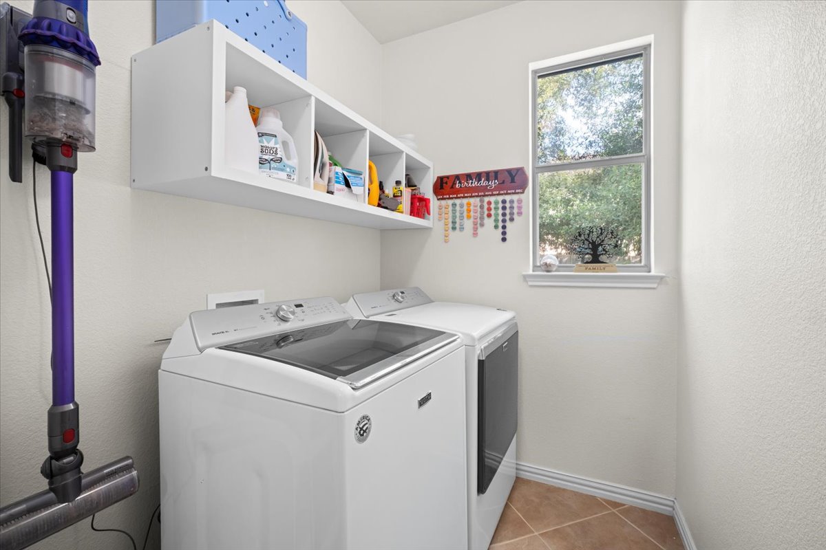 455 Logan Road Georgetown, TX 78628 - Photo 29 of 35 a utility room with dryer and washer