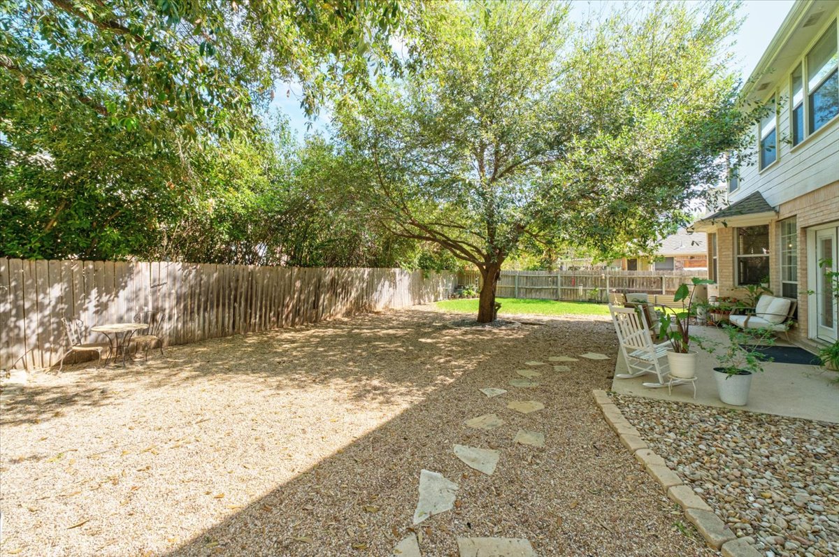 455 Logan Road Georgetown, TX 78628 - Photo 34 of 35 a view of a yard with plants and trees