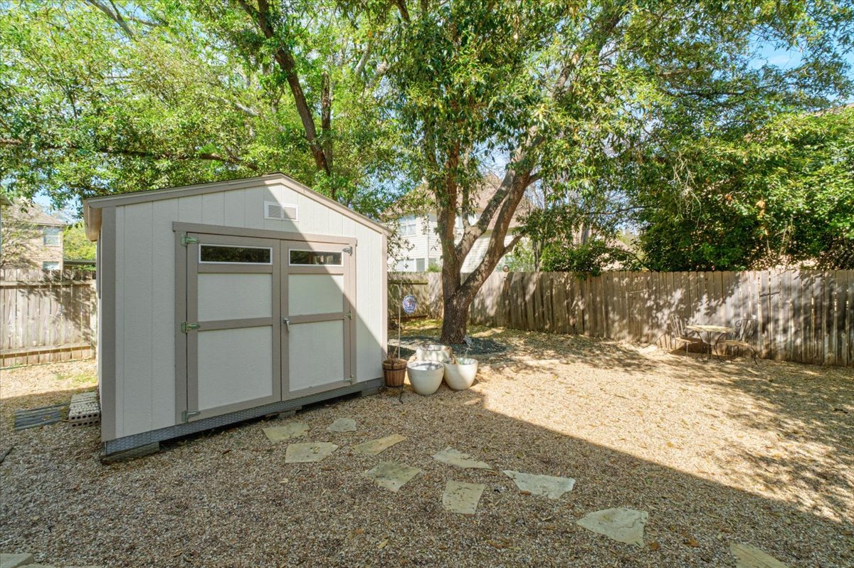 455 Logan Road Georgetown, TX 78628 - Photo 35 of 35 a view of a wooden house with large trees