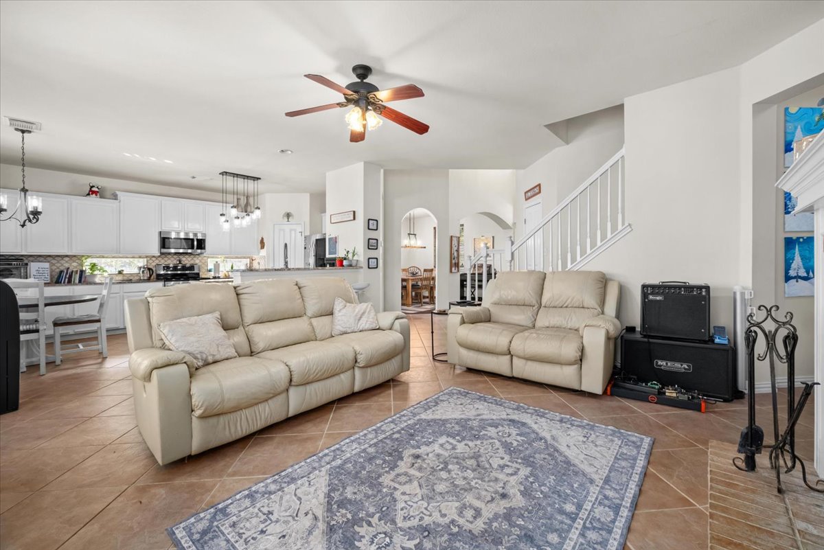 455 Logan Road Georgetown, TX 78628 - Photo 7 of 35 a living room with furniture and a flat screen tv
