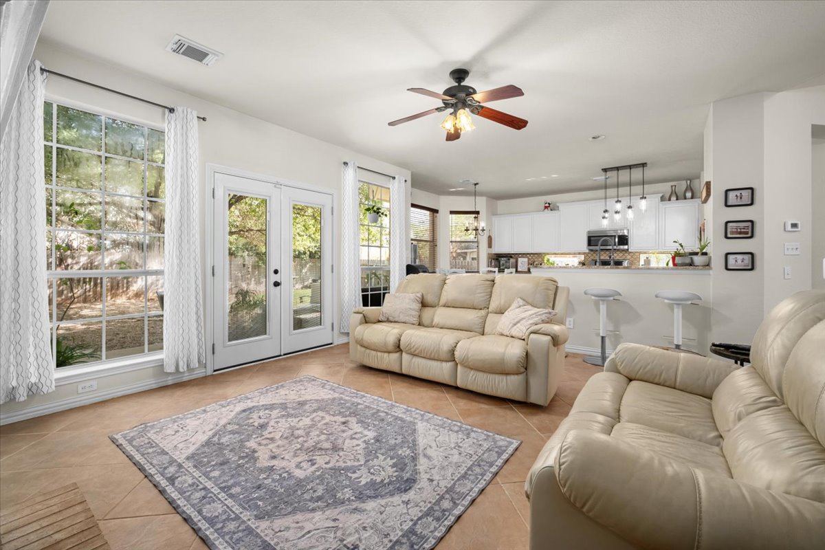 455 Logan Road Georgetown, TX 78628 - Photo 8 of 35 a living room with furniture and a rug