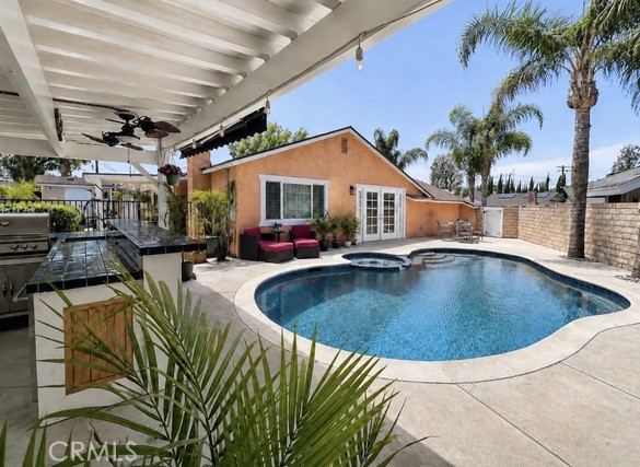 21104 Rosedell Drive Saugus, CA 91350 - Photo 6 of 33 Resort-style backyard with outdoor BBQ and bar overlooking the sparkling pool and spa