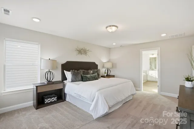 a bedroom with a bed and a table