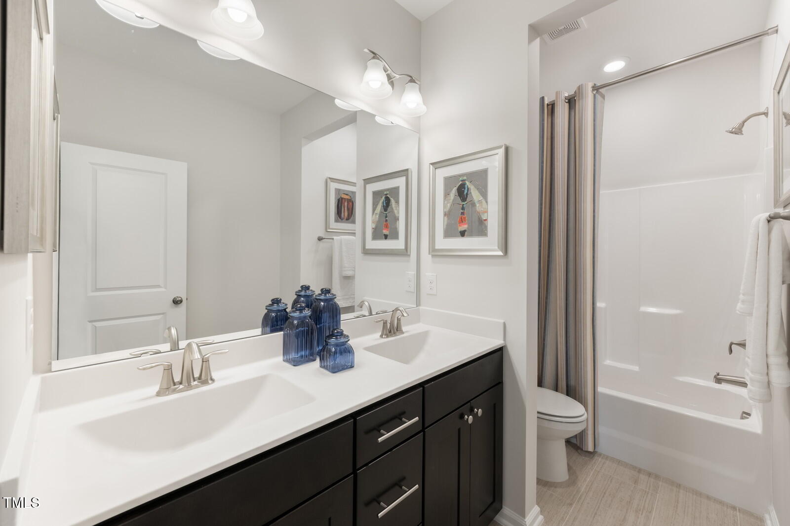 35 Stoddard Lane Garner, NC 27529 - Photo 28 of 38 a bathroom with a sink double vanity granite tub and a mirror