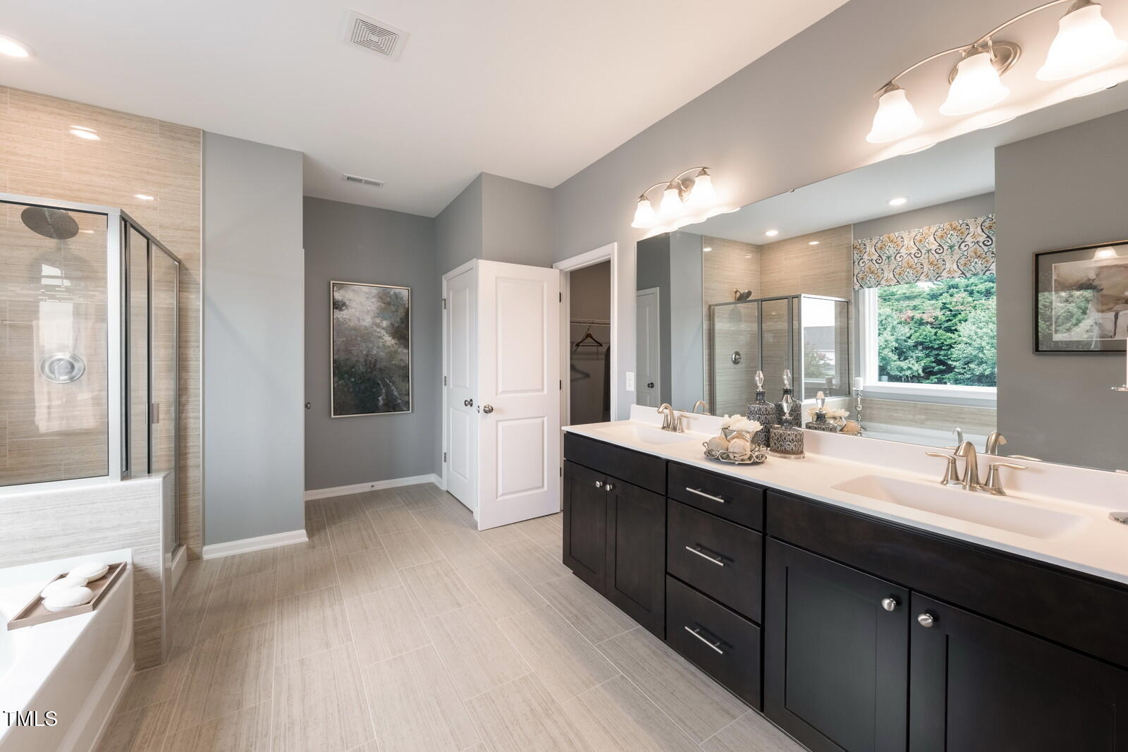 35 Stoddard Lane Garner, NC 27529 - Photo 33 of 38 a bathroom with a double vanity sink mirror and shower