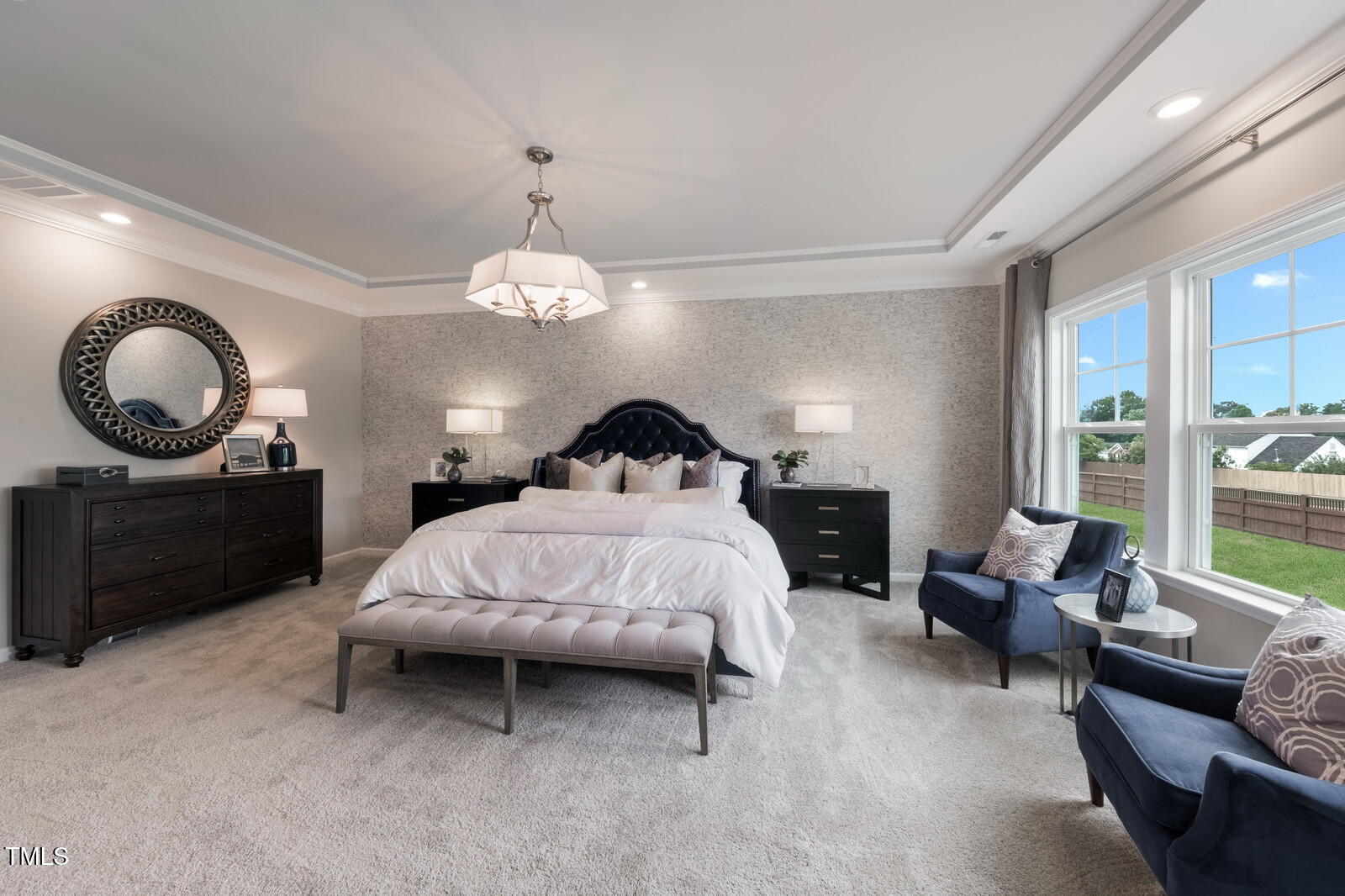 35 Stoddard Lane Garner, NC 27529 - Photo 35 of 38 a spacious bedroom with a bed a mirror and window