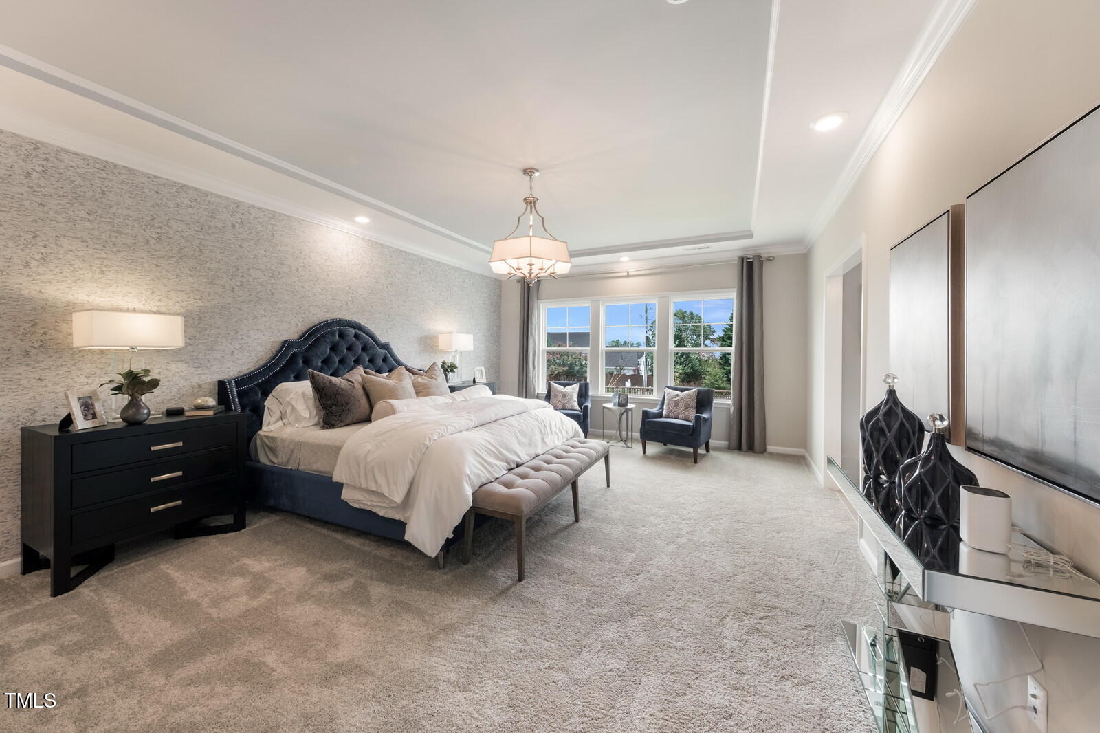 35 Stoddard Lane Garner, NC 27529 - Photo 36 of 38 a spacious bedroom with a bed and a large mirror