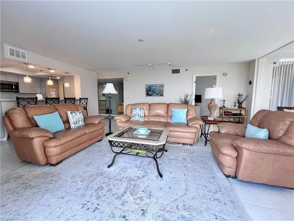 a living room with furniture and a table