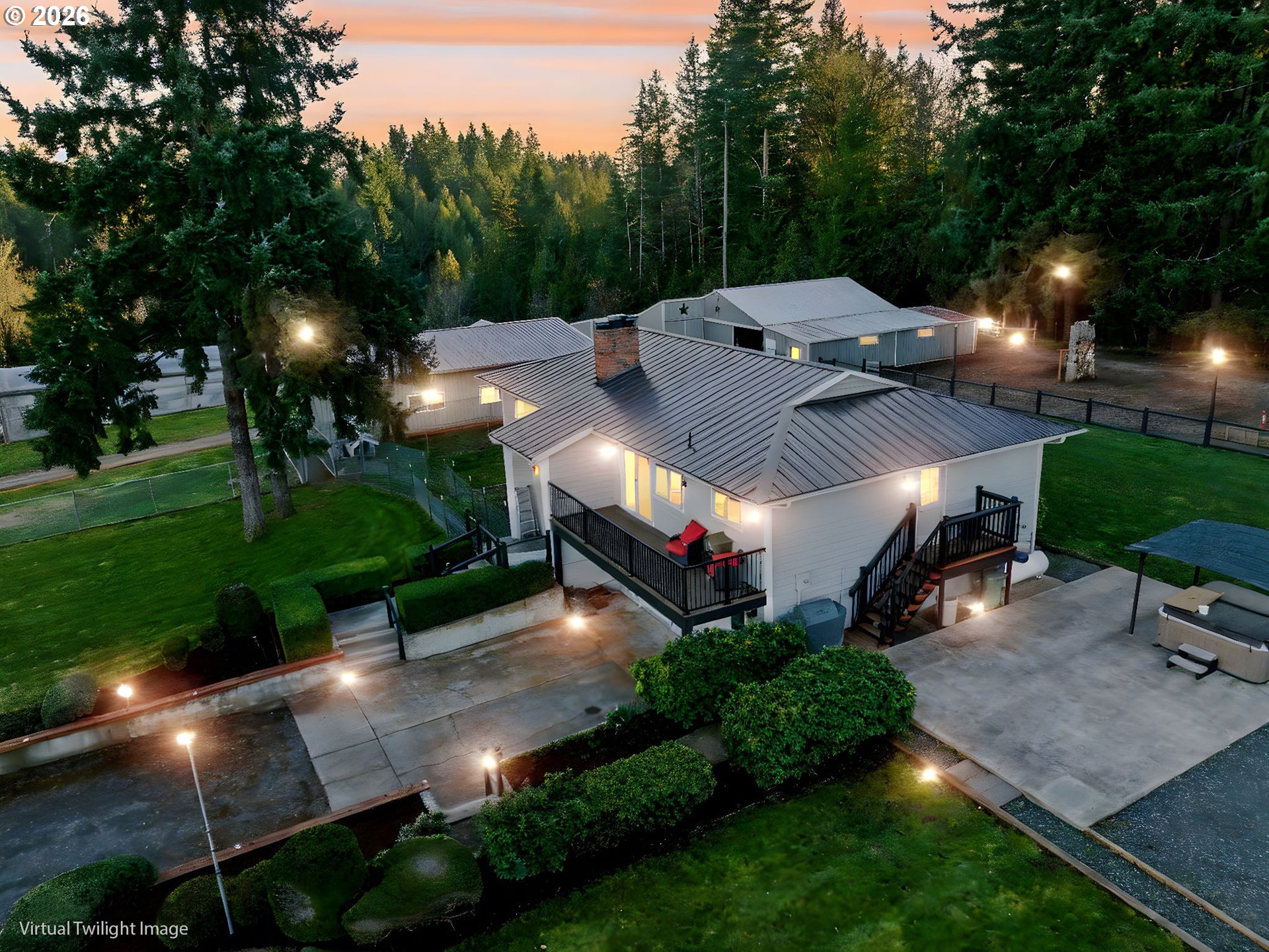 38100 Southeast Trubel Road Sandy, OR 97055 - Photo 1 of 48 a view of a patio with table and chairs potted plants and large trees
