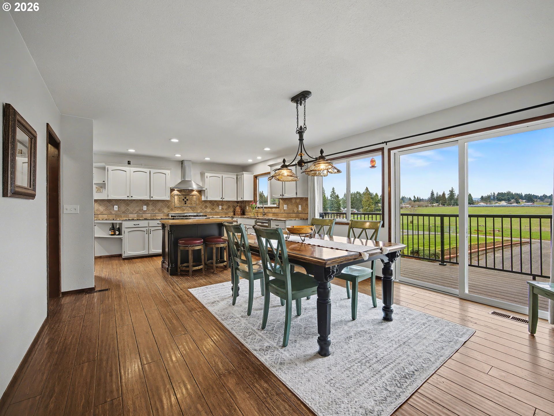 38100 Southeast Trubel Road Sandy, OR 97055 - Photo 11 of 48 a view of a dining room with furniture window and wooden floor