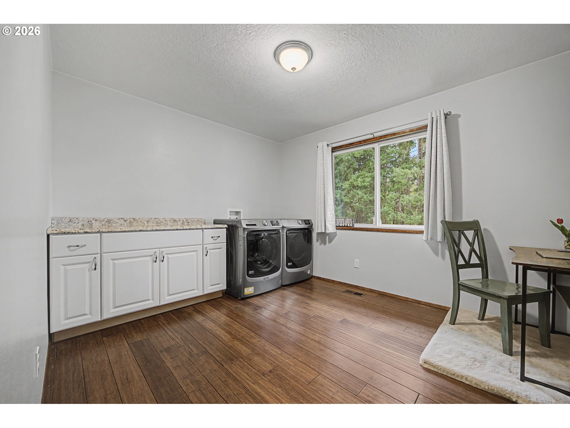 38100 Southeast Trubel Road Sandy, OR 97055 - Photo 22 of 48 a view of a kitchen with wooden floor and a window