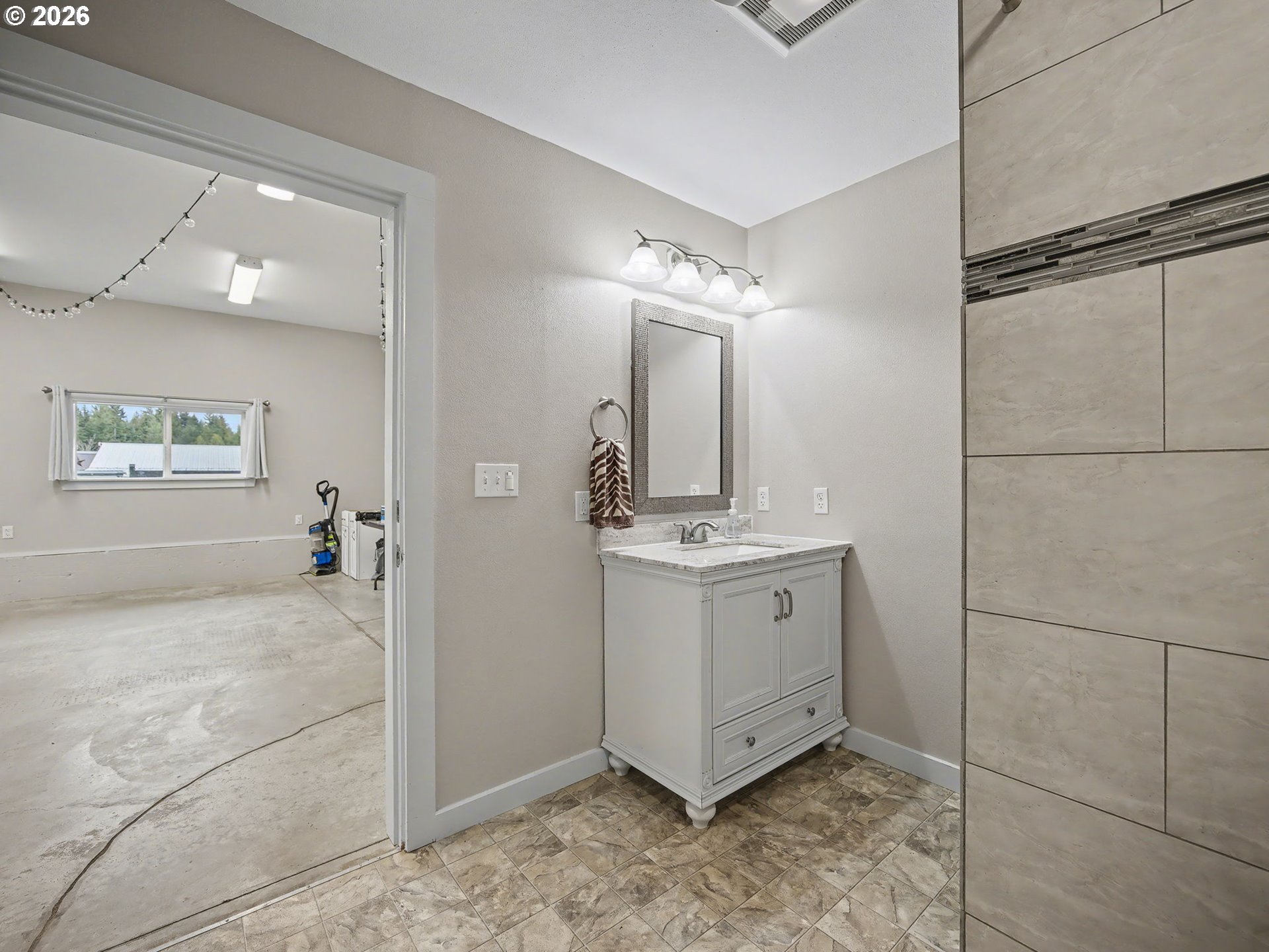 38100 Southeast Trubel Road Sandy, OR 97055 - Photo 34 of 48 a bathroom with a granite countertop sink mirror and vanity