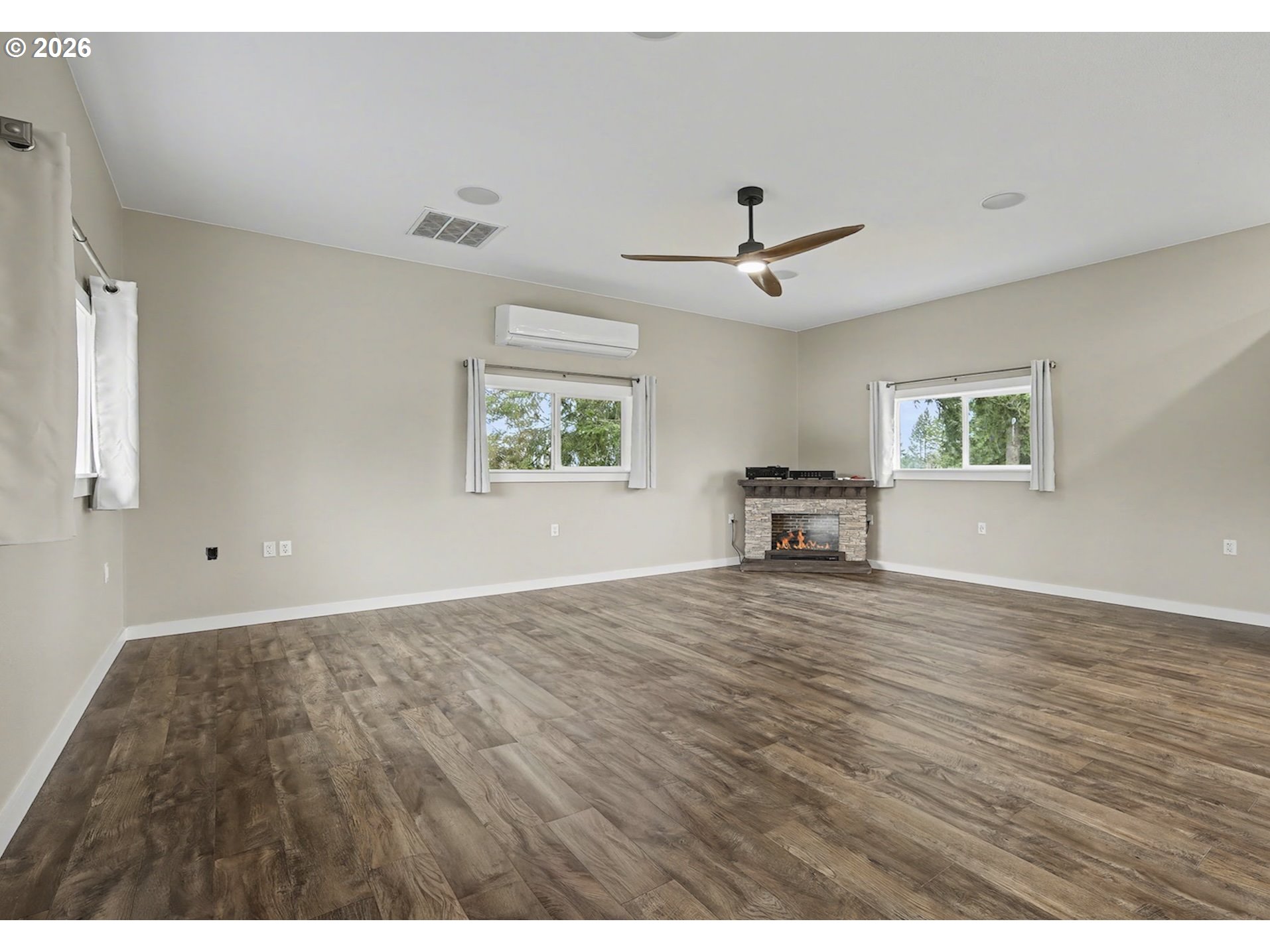 38100 Southeast Trubel Road Sandy, OR 97055 - Photo 37 of 48 a view of a livingroom with furniture a ceiling fan and wooden floor