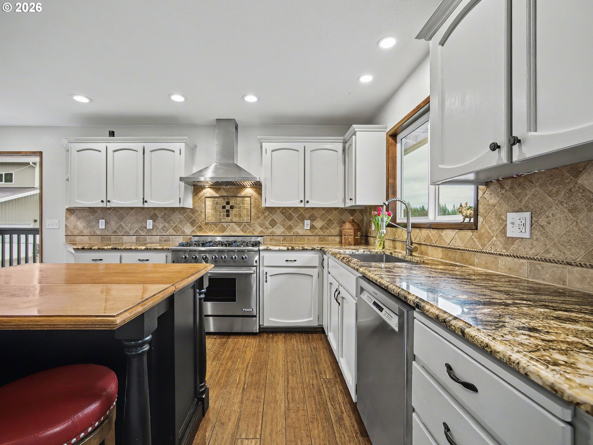 38100 Southeast Trubel Road Sandy, OR 97055 - Photo 9 of 48 a kitchen with stainless steel appliances granite countertop sink stove top oven and cabinets