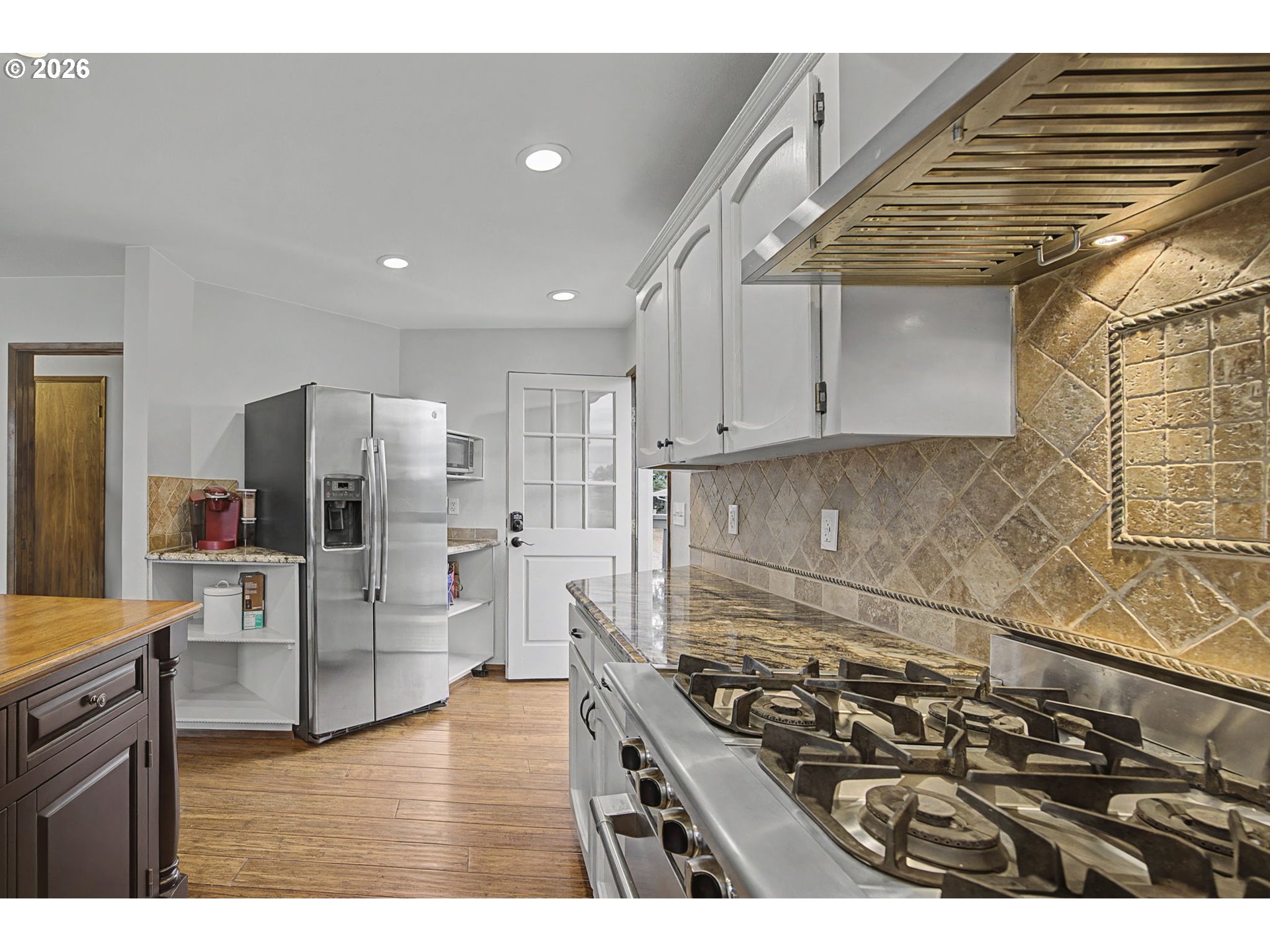 38100 Southeast Trubel Road Sandy, OR 97055 - Photo 10 of 48 a kitchen with stainless steel appliances granite countertop a stove and a refrigerator