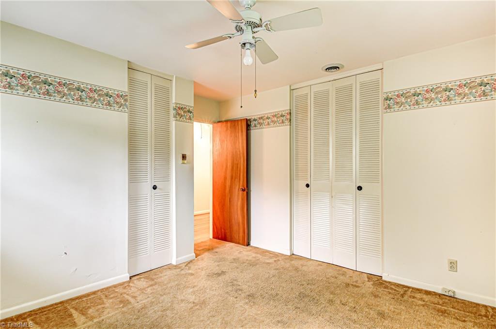 3915 Frazier Road Greensboro, NC 27407 - Photo 14 of 25 Bedroom 2 has two closets. Hardwoods under carpet.