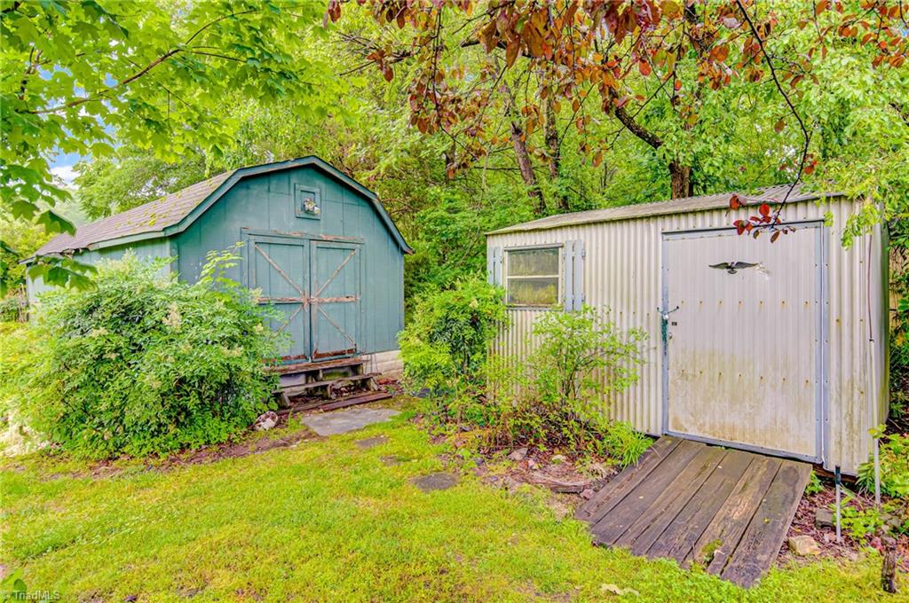 3915 Frazier Road Greensboro, NC 27407 - Photo 22 of 25 The big one for hobbies, the small one for yard tools.