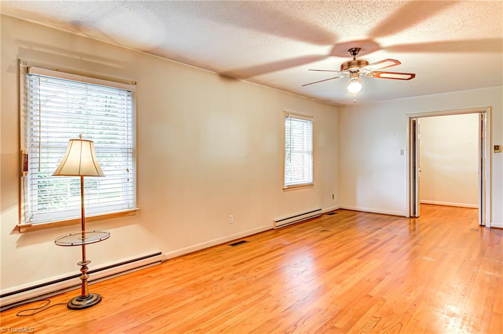 3915 Frazier Road Greensboro, NC 27407 - Photo 5 of 25 Living room looking back to entry.