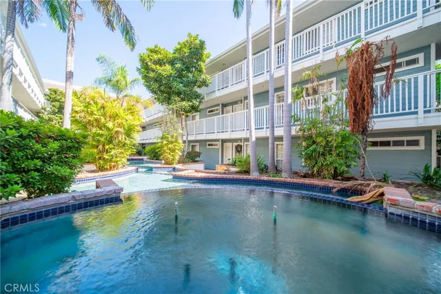 a view of swimming pool with outdoor seating