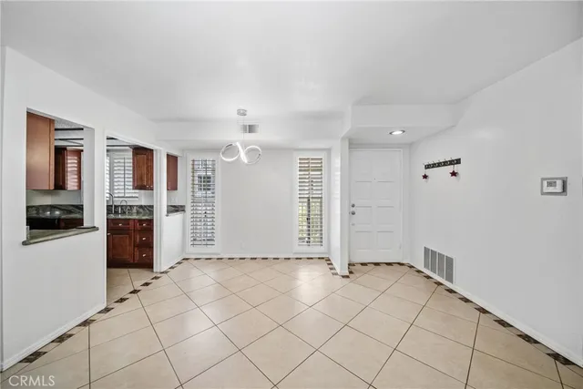 a view of a big room with closet and windows