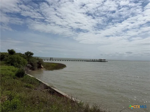 a view of a lake from a yard