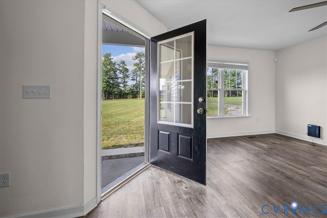 11325 Webb Road Disputanta, VA 23842 - Photo 3 of 32 Foyer entrance featuring wood finished floors and