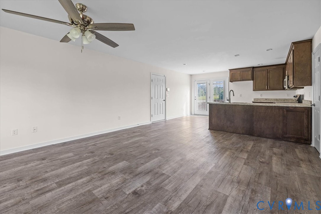 11325 Webb Road Disputanta, VA 23842 - Photo 32 of 32 Kitchen featuring open floor plan, dark brown cabi