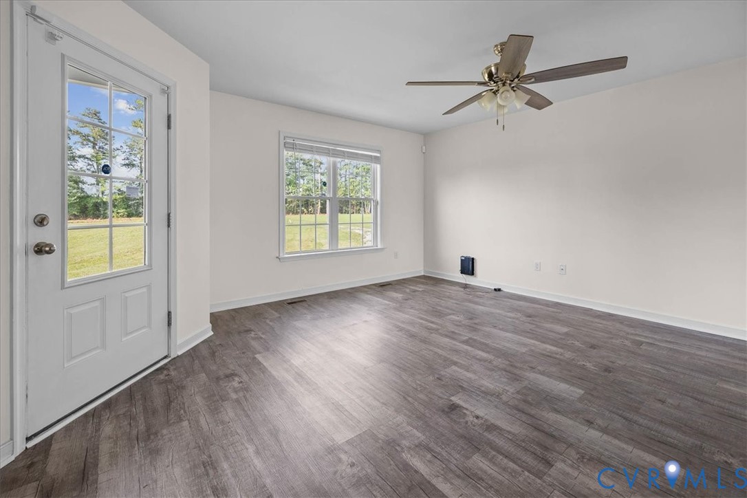 11325 Webb Road Disputanta, VA 23842 - Photo 4 of 32 Spare room with dark wood-type flooring and ceilin