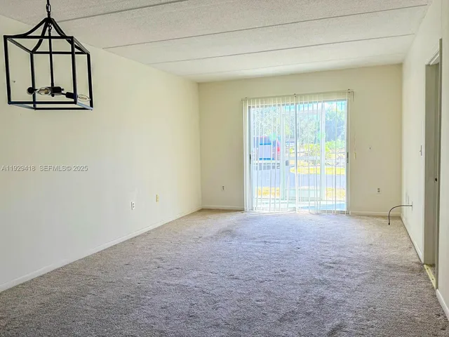 a view of a room that has a window in it