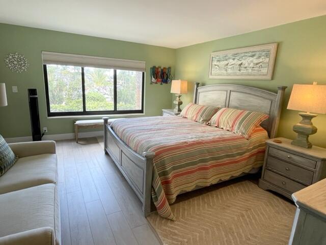 500 Ocean Trail Way, Unit 204 Jupiter, FL 33477 - Photo 11 of 40 a bedroom with a bed and a couch