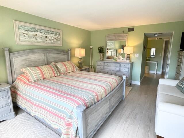 500 Ocean Trail Way, Unit 204 Jupiter, FL 33477 - Photo 12 of 40 a bedroom with bed and table