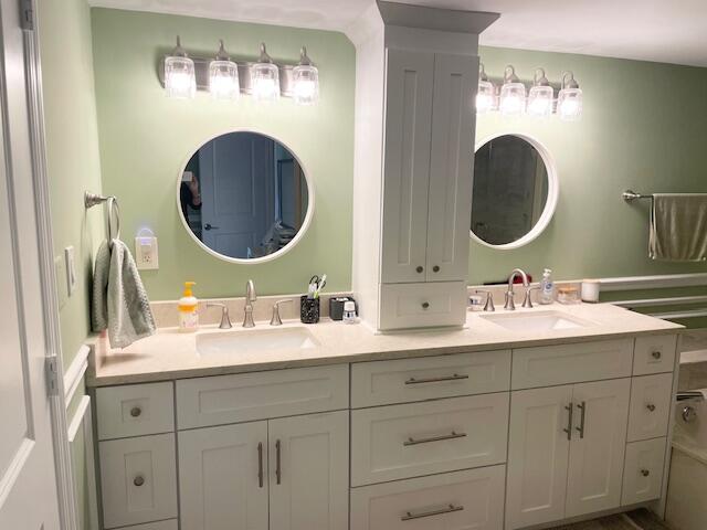 500 Ocean Trail Way, Unit 204 Jupiter, FL 33477 - Photo 13 of 40 a bathroom with a sink and a mirror