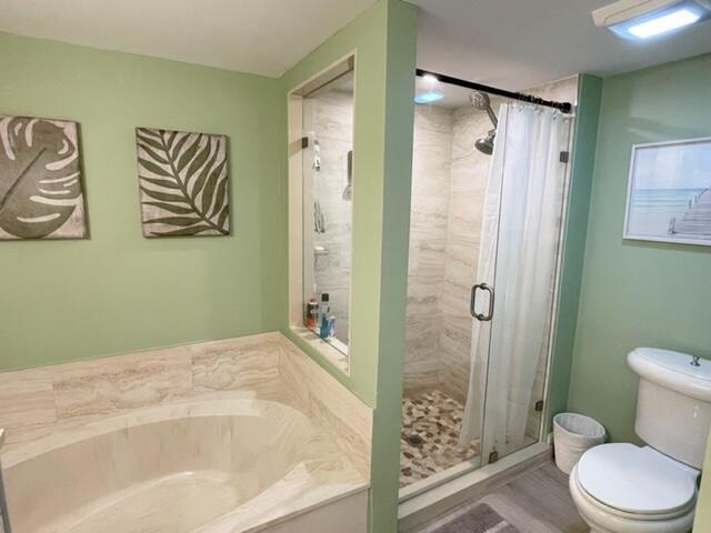 500 Ocean Trail Way, Unit 204 Jupiter, FL 33477 - Photo 14 of 40 a bathroom with a shower and a toilet