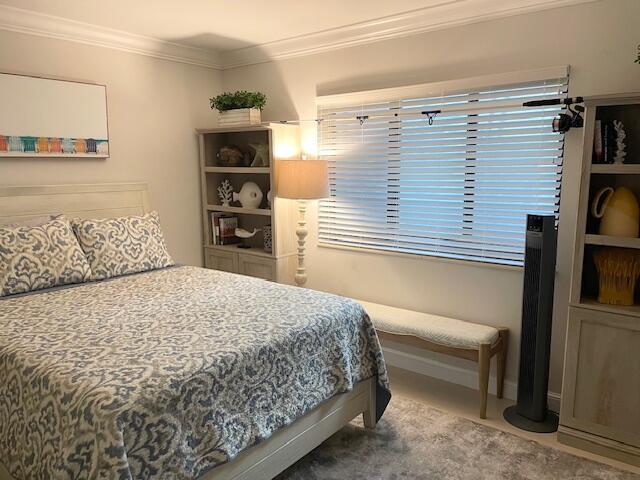 500 Ocean Trail Way, Unit 204 Jupiter, FL 33477 - Photo 16 of 40 a bedroom with a large bed and a tv