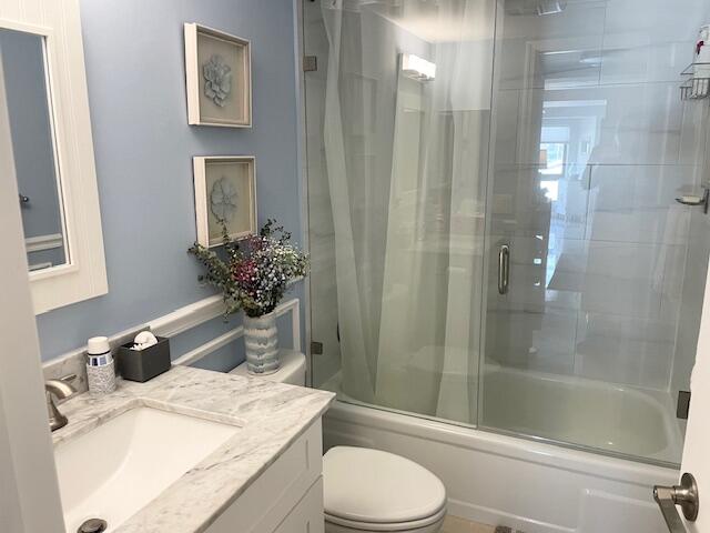 500 Ocean Trail Way, Unit 204 Jupiter, FL 33477 - Photo 17 of 40 a bathroom with a sink a toilet and shower
