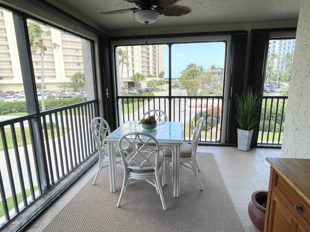 500 Ocean Trail Way, Unit 204 Jupiter, FL 33477 - Photo 19 of 40 a view of a dining room with furniture window and outside view
