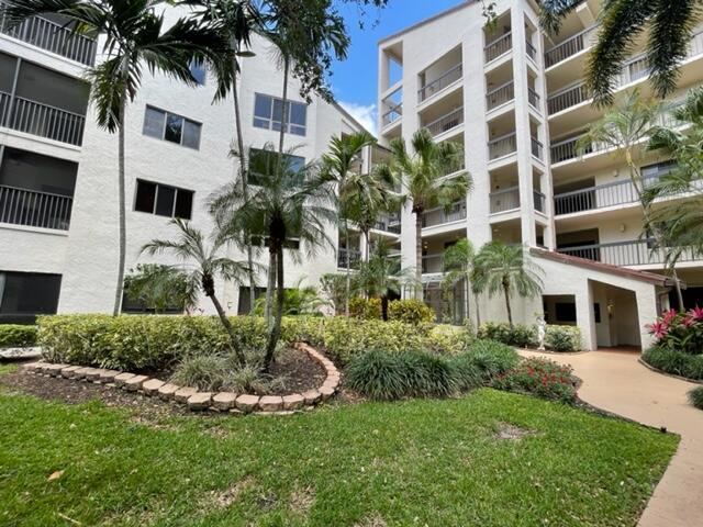 500 Ocean Trail Way, Unit 204 Jupiter, FL 33477 - Photo 22 of 40 a front view of a multi story building with yard
