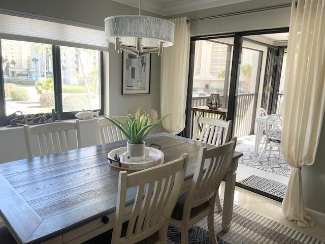 500 Ocean Trail Way, Unit 204 Jupiter, FL 33477 - Photo 7 of 40 a view of a dining room with furniture window and outside view
